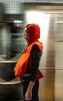Wearing the tote as a hood in a dark hallway