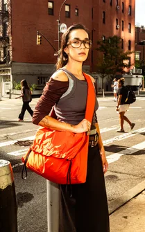 Crossing a New York street with the orange tote